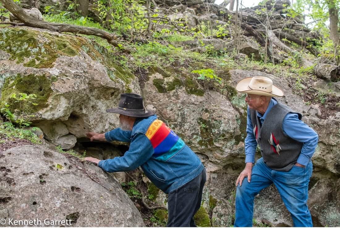 Bruce Bradley and Mike Collins pointing out an outcropping of chert, a rich source of tool making material utilized by hunter-gatherers at Gault for thousands of years.